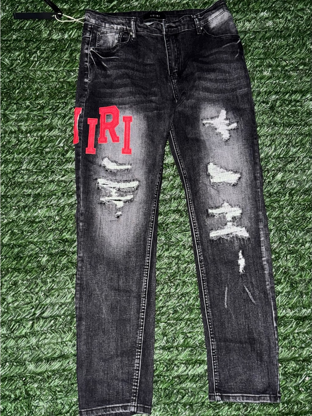 AMIRI Black Skinny Distressed Jeans with Red Lettering
